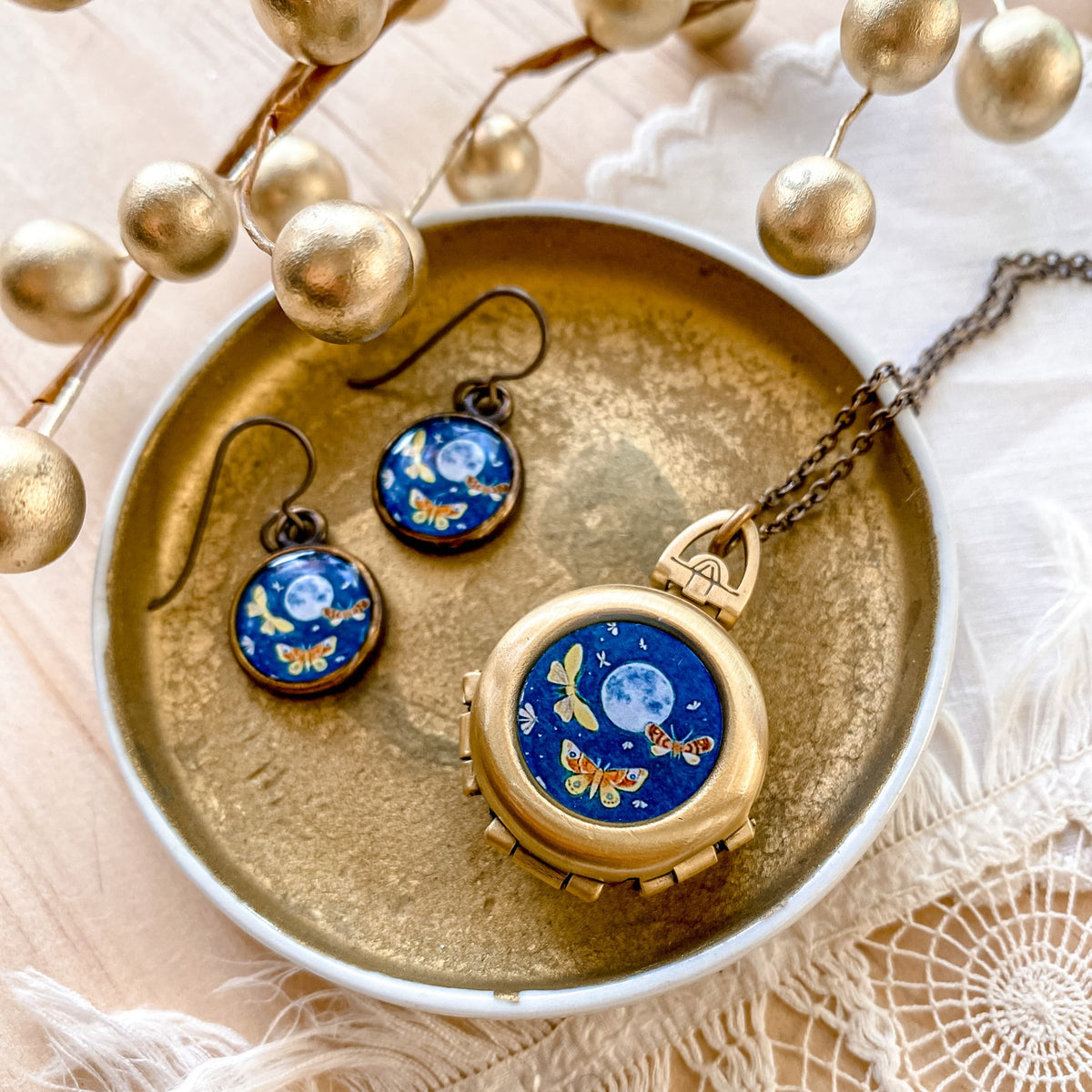 a blue and gold necklace and earring set