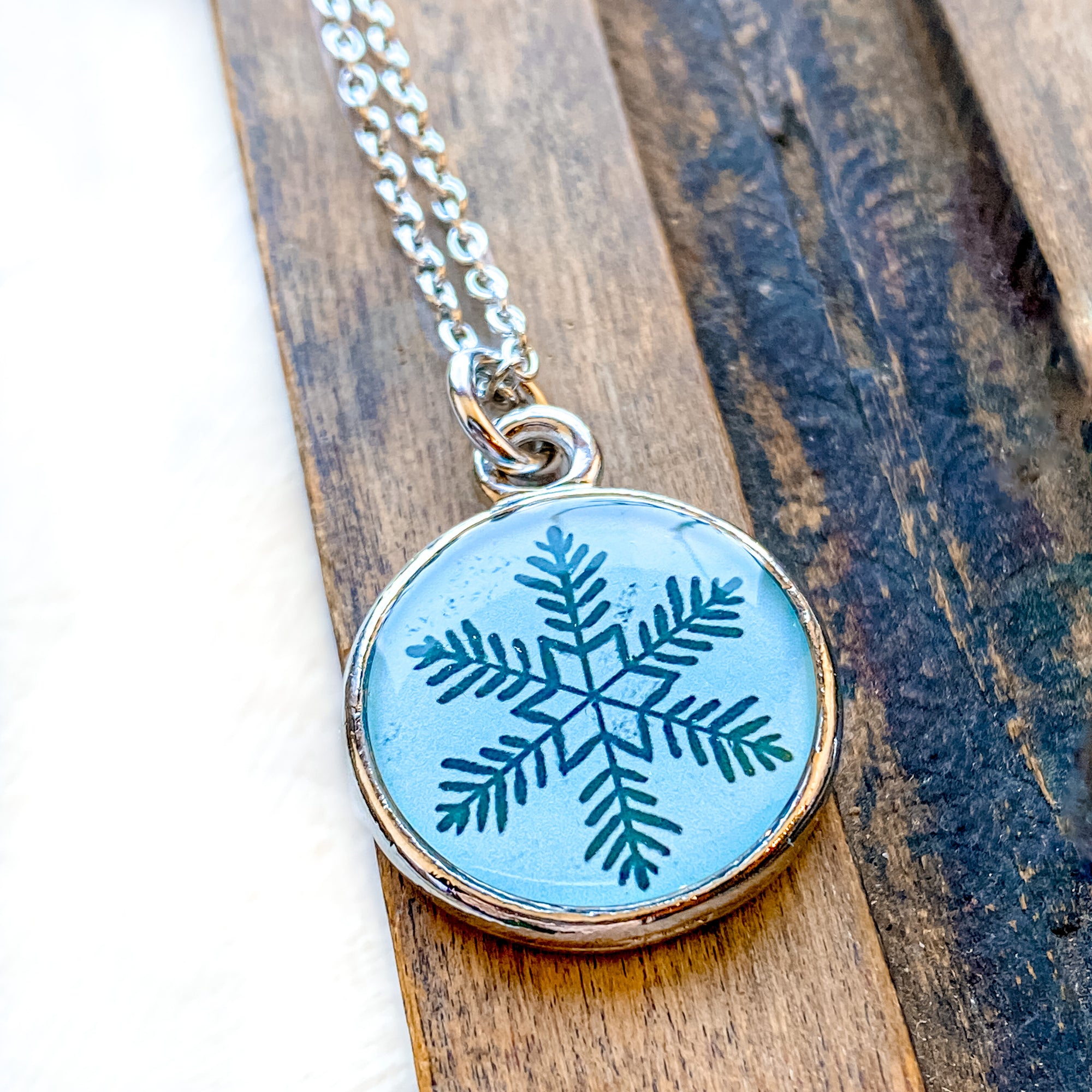 a necklace with a snowflake design on it
