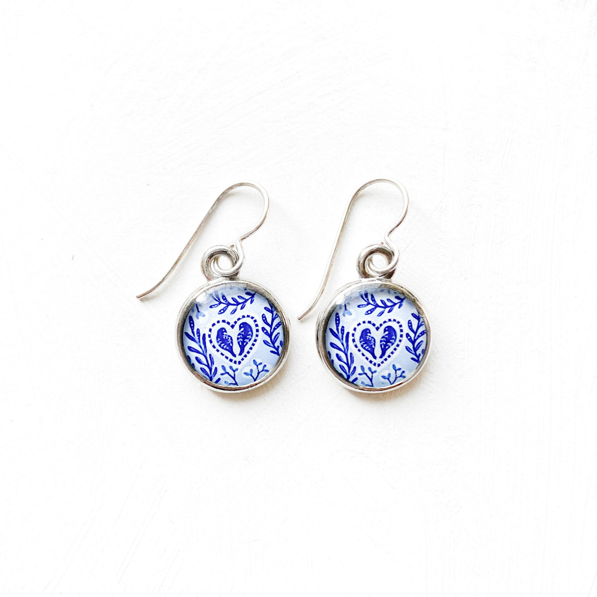 a pair of blue and white porcelain earrings