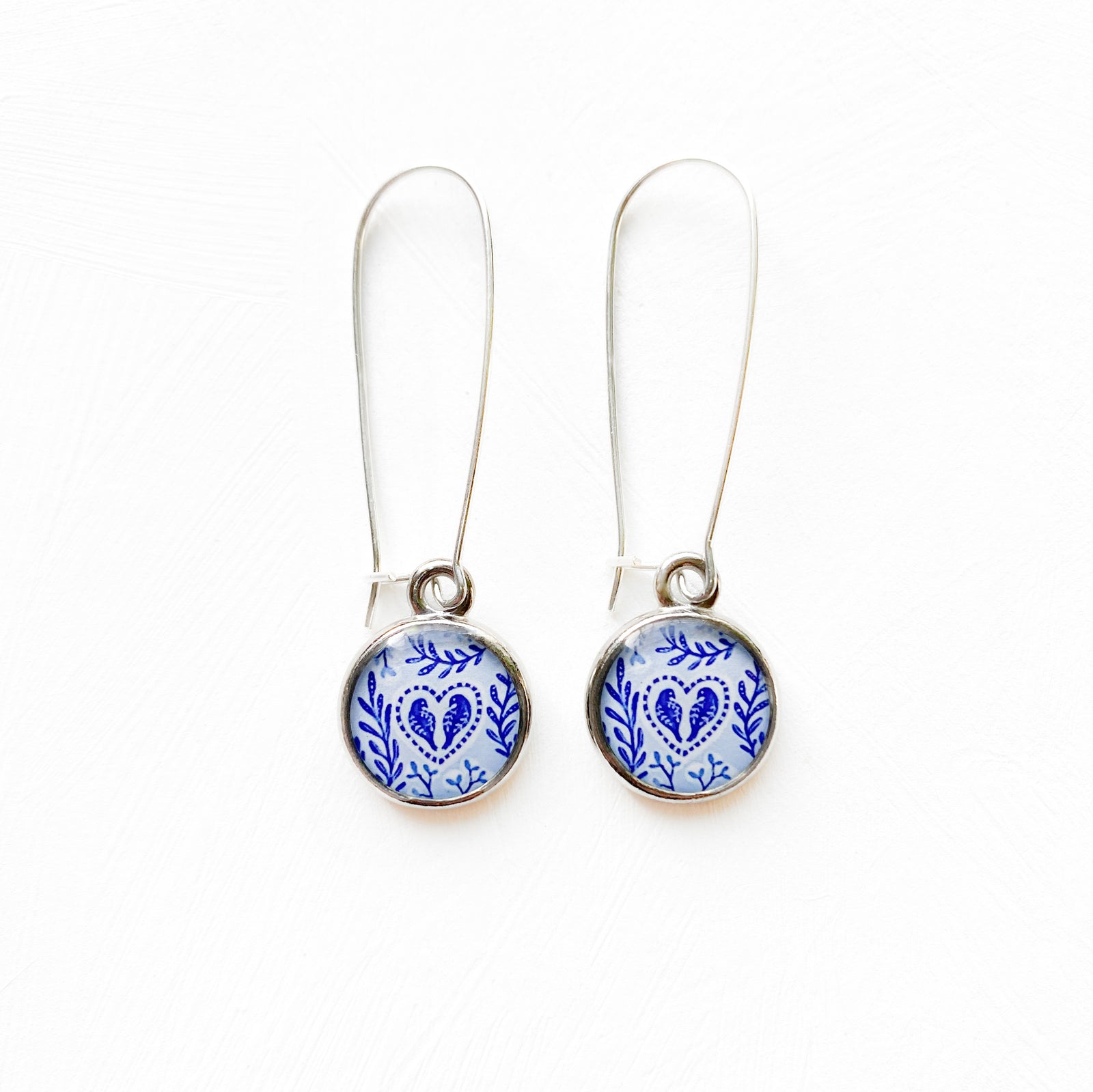 a pair of blue and white porcelain earrings